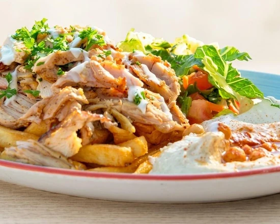 Chicken shawarma platter with garlic sauce, pickles and rice at Yafa Café in Winnipeg, MB