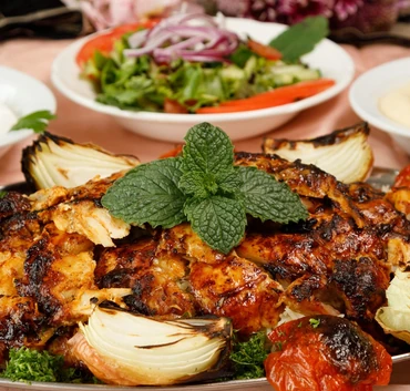 Chicken shawarma platter with garlic sauce and pickles at Yafa Café, halal kitchen in Winnipeg