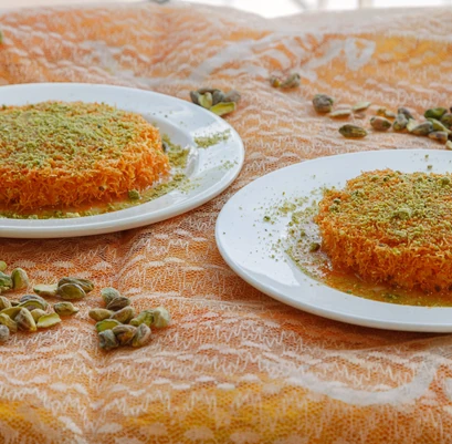 Knafeh Nabulsi kunafa dessert soaked in sweet syrup at Yafa Café near Polo Park, Winnipeg