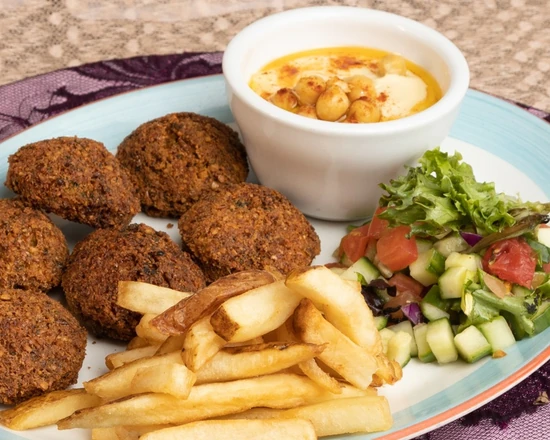 Fresh-fried falafel with tahini at Yafa Café, vegan Palestinian street food in Winnipeg, MB