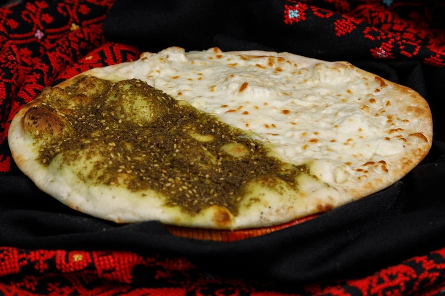 Za'atar and cheese manakeesh baked fresh at Yafa Café on Portage Avenue in Winnipeg, MB